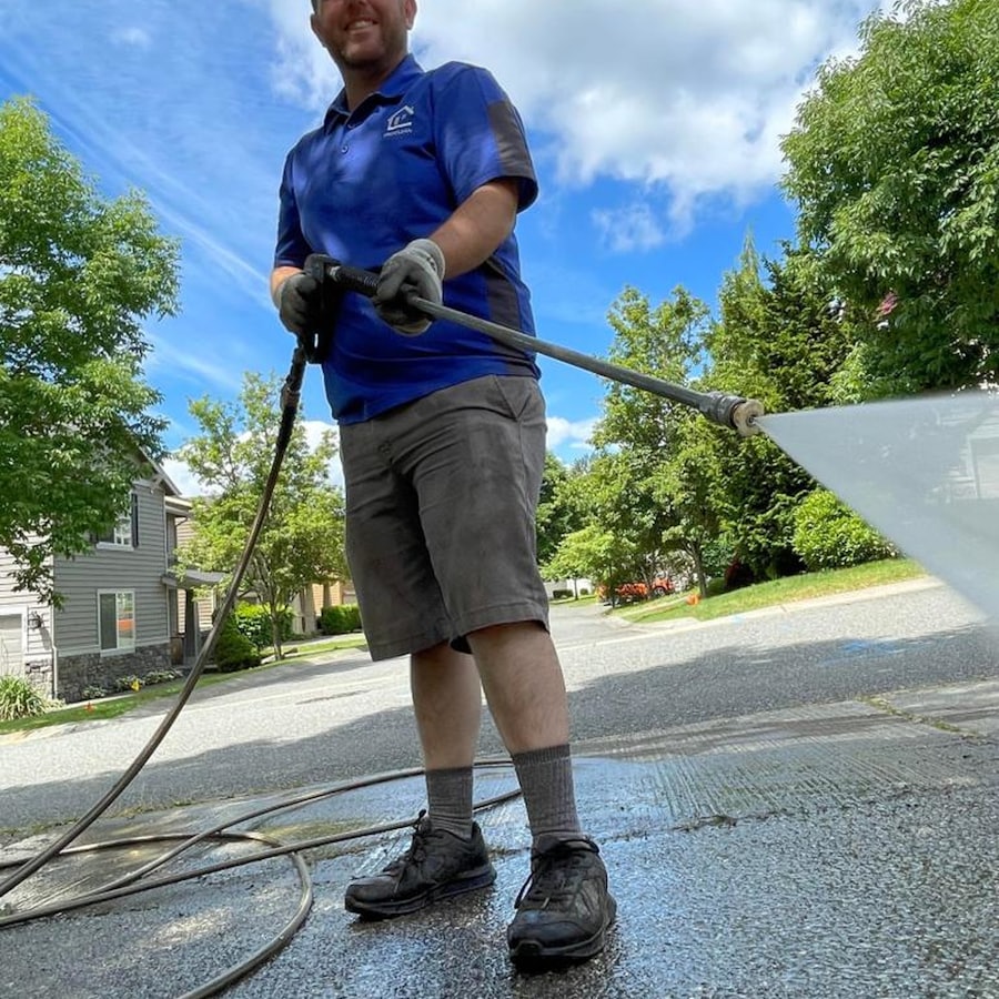 Driveway being washed with a high-pressure spray